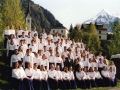Choir in front of Alps